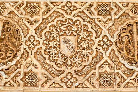 geometric and decorative figures on the walls of the buildings of the Alhambra in Granada,...