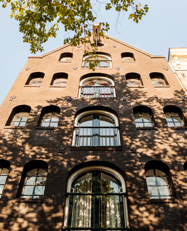 Facade of old building in Amsterdam, Netherlandsの写真素材