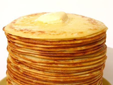 heap of pancakes with thaw piece of butter on itの写真素材