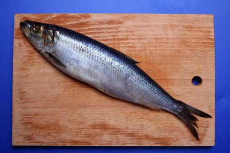 salty herring on a board by diagonalの写真素材