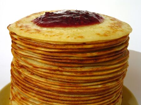 heap of pancakes with home-made jam on itの写真素材