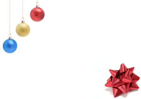 New Year's celebratory ornaments of three colors and gift bow of red colorの写真素材