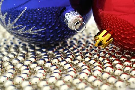 Two christmas glass spheres on a golden beads の写真素材