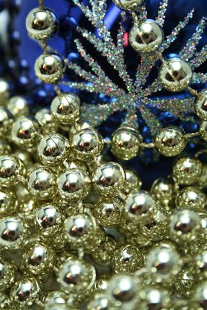 Dark blue christmas sphere with a pattern and a brilliant celebratory beadsの写真素材