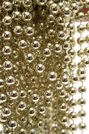Celebratory brilliant beads of golden color vertically 1の写真素材