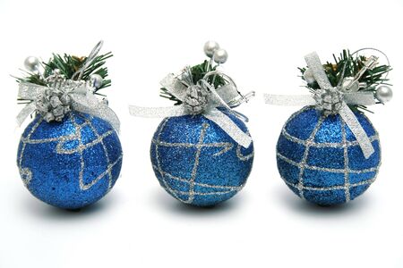 Three christmas spheres of dark blue color with a pattern horizontally の写真素材