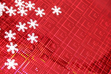 Christmas background of red color with white snowflakes in a cornerの写真素材