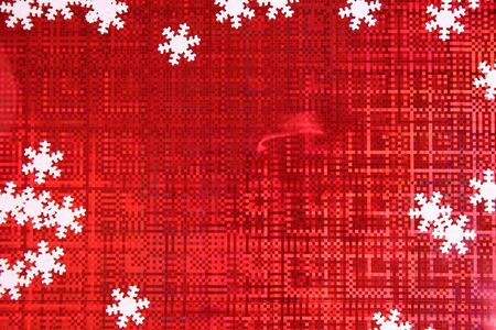Christmas background of red color with white snowflakes on each sideの写真素材