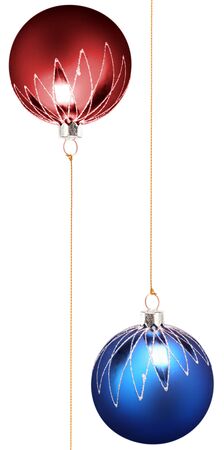 Two christmas spheres of dark blue and red color with a pattern on a white background の写真素材