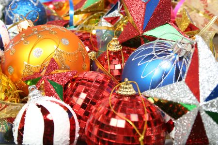 New Year's ornaments of different color in the form of glass spheres and starsの写真素材