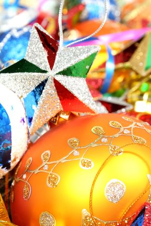 Christmas ornaments of different color in the form of glass spheres and starsの写真素材