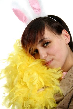 The young bunny girl with the pink rabbit ears and yellow feathers, isolatedの写真素材