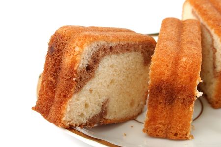 Slices of a chocolate cake on a white background の写真素材