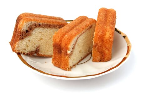 Slices of a chocolate cake on a white background の写真素材