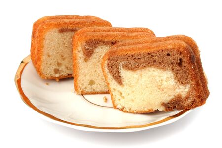 Slices of a chocolate cake on a white background の写真素材