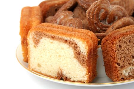 Slices of a chocolate cake on a white background の写真素材