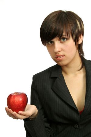 Friendly businesswoman with red apple, isolated on whiteの写真素材