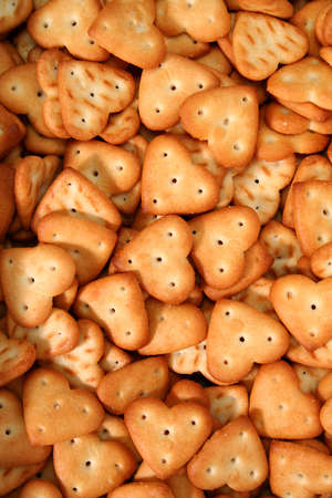 Salty cookies in the form of hearts, backgroundsの写真素材
