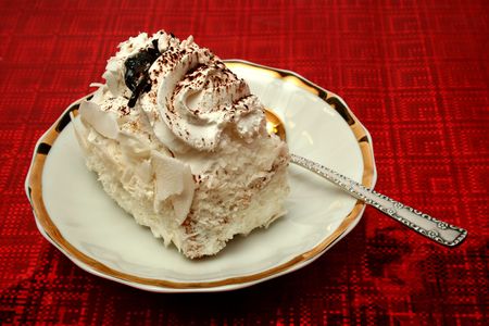 Slice of a pie with a cream on a red background, (look similar images in my portfolio)の写真素材
