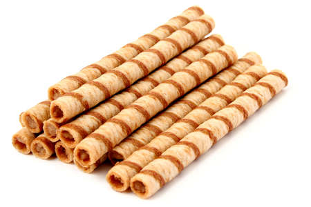 Heap of striped wafer tubules with the chocolate cream, isolated, (look similar images in my portfolio)の写真素材