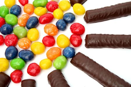Chocolate sticks with a cream and the multi-coloured sweets isolated, (look similar images in my portfolio)の写真素材