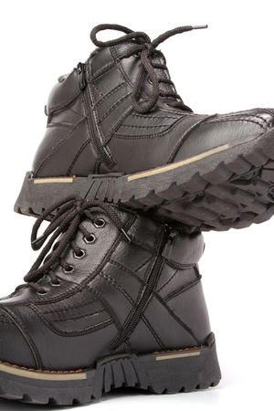 Two man's winter leather boots of darkly brown color, vertically, isolated on white, (look similar images in my portfolio)の写真素材