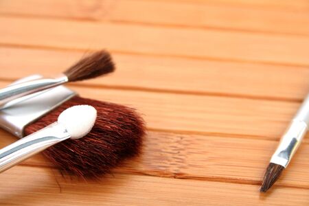 makeup brushes on wooden carpet 1の写真素材
