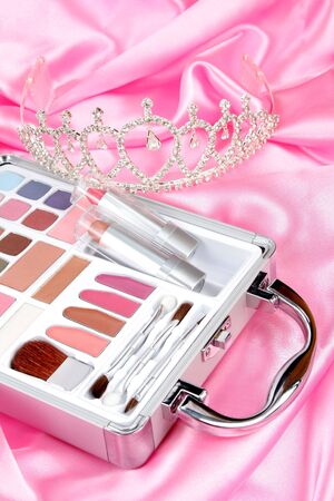 Makeup briefcase on pink satin and diadem 2の写真素材