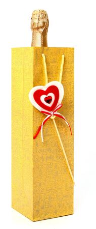 Bottle with a champagne in package with small heart の写真素材