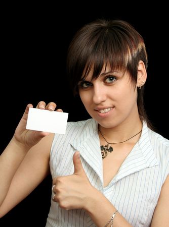 girl with blank card, isolated on blackの写真素材