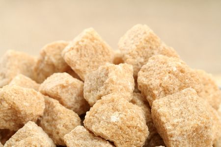 Stack of not refined brown reed sugar, backgroundの写真素材