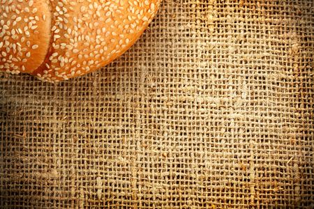 Croissant with sesame on a sacking backgroundの写真素材
