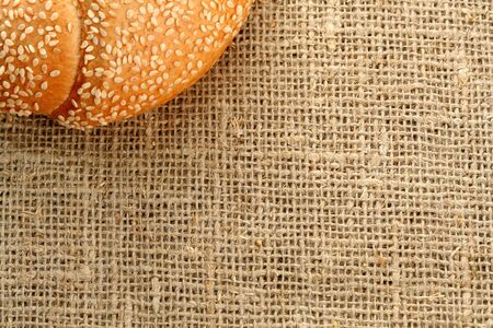 Croissant with sesame on a sacking backgroundの写真素材