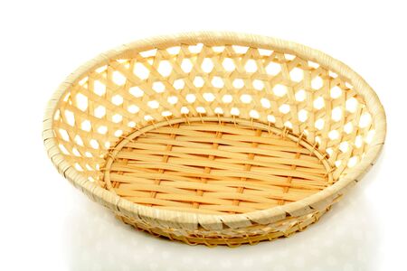 Empty straw basket, isolated on whiteの写真素材