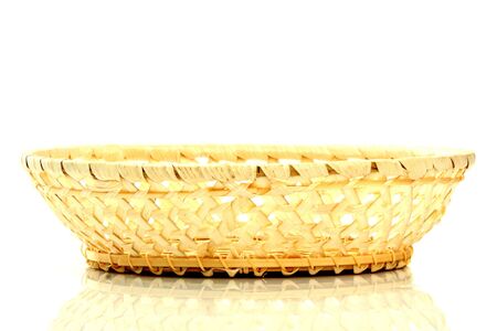 Empty straw basket, isolated on whiteの写真素材