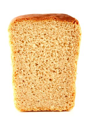 Slised loaf of fresh bread, isolated on whiteの写真素材