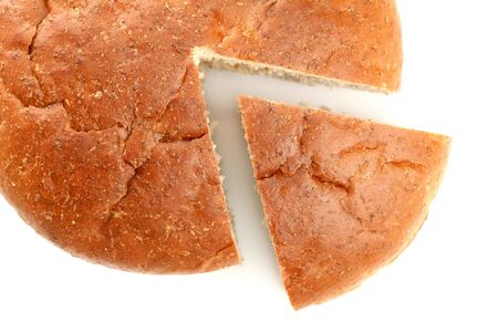 Slised loaf of fresh bread, isolated on whiteの写真素材