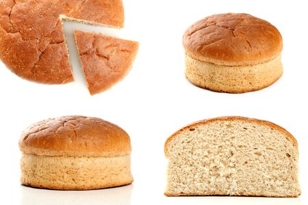 Slised loaf of fresh bread, isolated on whiteの写真素材