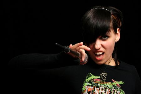 Young singer, on black backgroundの写真素材