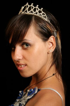 Girl with a diadem, isolated on blackの写真素材