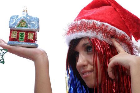 Christmas girl with new home, isolated on whiteの写真素材