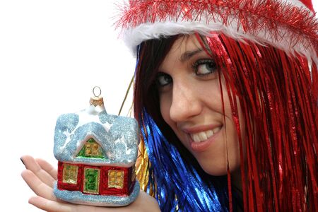 Christmas girl with new home, isolated on whiteの写真素材