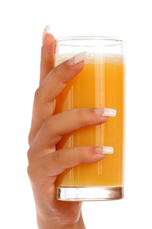 Manicure and orange juice, isolated on whiteの写真素材