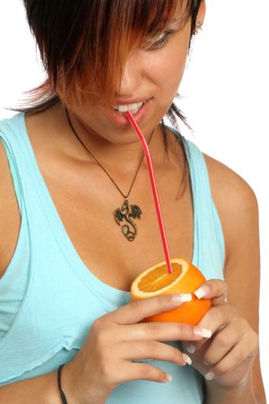 beautiful girl with sliced orange on whiteの写真素材