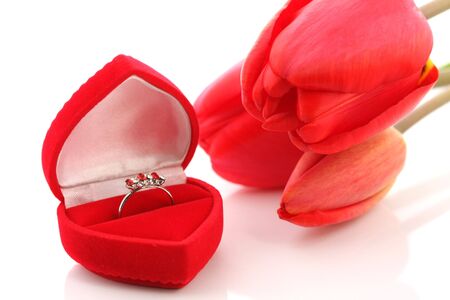 Red tulips and Jewelry Box with ring on a white backgroundの写真素材