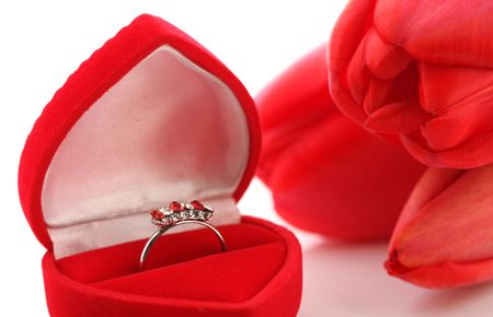 Red tulips and Jewelry Box with ring on a white backgroundの写真素材