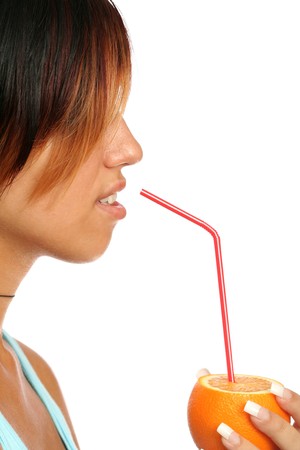 beautiful girl with sliced orange on whiteの写真素材