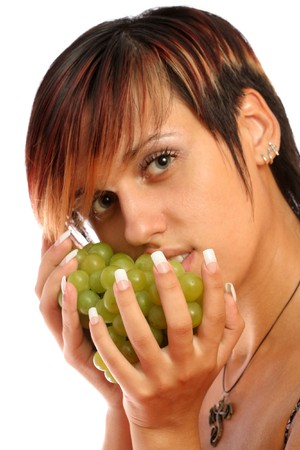 beautiful girl with green grape on whiteの写真素材