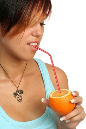 beautiful girl with sliced orange on whiteの写真素材