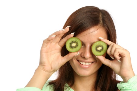 beautiful woman with kiwi on whiteの写真素材